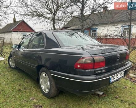 Черный Опель Омега, объемом двигателя 2.5 л и пробегом 274 тыс. км за 2000 $, фото 1 на Automoto.ua