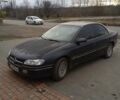 Черный Опель Омега, объемом двигателя 2.5 л и пробегом 328 тыс. км за 3000 $, фото 1 на Automoto.ua