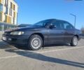 Чорний Опель Омега, об'ємом двигуна 2 л та пробігом 300 тис. км за 2000 $, фото 1 на Automoto.ua