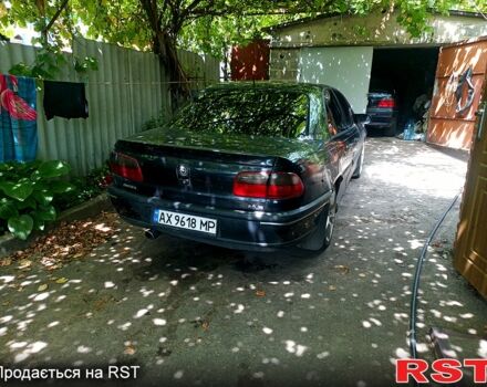 Опель Омега 1996 в Чугуеве на Automoto.ua Черный Опель Омега, объемом двигателя 2 л и пробегом 350 тыс. км за 2000 $, фото 4 на Automoto.ua