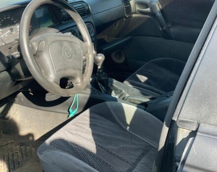 Черный Опель Омега, объемом двигателя 2 л и пробегом 200 тыс. км за 1500 $, фото 3 на Automoto.ua