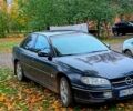 Чорний Опель Омега, об'ємом двигуна 2 л та пробігом 250 тис. км за 2000 $, фото 1 на Automoto.ua