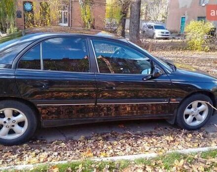 Чорний Опель Омега, об'ємом двигуна 2 л та пробігом 300 тис. км за 2600 $, фото 2 на Automoto.ua