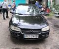 Черный Опель Омега, объемом двигателя 2 л и пробегом 300 тыс. км за 1250 $, фото 1 на Automoto.ua