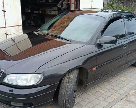 Чорний Опель Омега, об'ємом двигуна 3 л та пробігом 260 тис. км за 3000 $, фото 1 на Automoto.ua