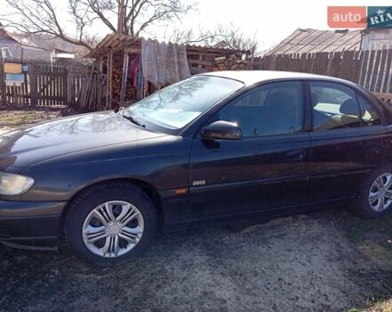 Черный Опель Омега, объемом двигателя 2.2 л и пробегом 330 тыс. км за 2500 $, фото 1 на Automoto.ua