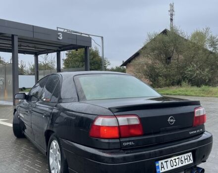 Черный Опель Омега, объемом двигателя 2.5 л и пробегом 333 тыс. км за 1800 $, фото 3 на Automoto.ua