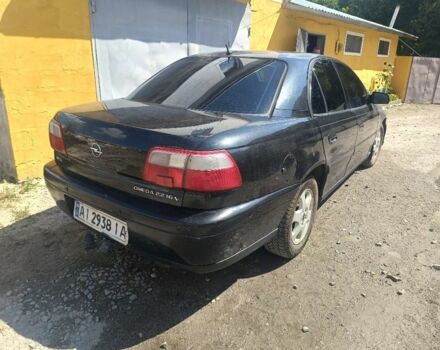 Черный Опель Омега, объемом двигателя 2.2 л и пробегом 300 тыс. км за 1200 $, фото 11 на Automoto.ua