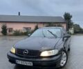 Черный Опель Омега, объемом двигателя 2.5 л и пробегом 333 тыс. км за 1800 $, фото 1 на Automoto.ua