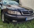 Черный Опель Омега, объемом двигателя 2.2 л и пробегом 274 тыс. км за 3000 $, фото 1 на Automoto.ua