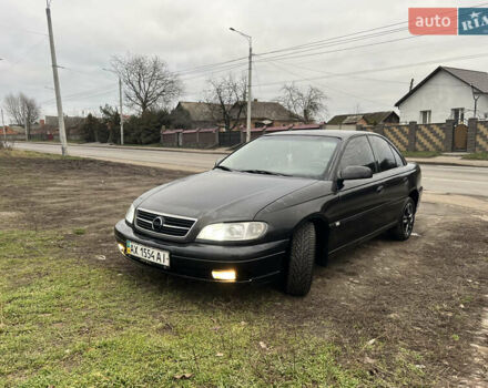 Черный Опель Омега, объемом двигателя 2.2 л и пробегом 319 тыс. км за 2000 $, фото 3 на Automoto.ua