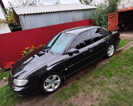 Черный Опель Омега, объемом двигателя 2.6 л и пробегом 434 тыс. км за 3500 $, фото 12 на Automoto.ua