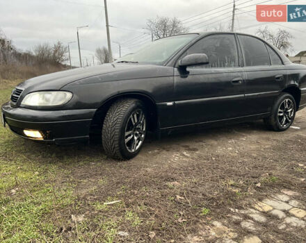 Черный Опель Омега, объемом двигателя 2.2 л и пробегом 319 тыс. км за 2000 $, фото 2 на Automoto.ua