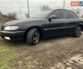 Черный Опель Омега, объемом двигателя 2.2 л и пробегом 319 тыс. км за 2000 $, фото 2 на Automoto.ua