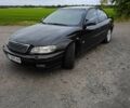Черный Опель Омега, объемом двигателя 2.2 л и пробегом 225 тыс. км за 3058 $, фото 1 на Automoto.ua