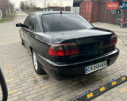 Черный Опель Омега, объемом двигателя 2.5 л и пробегом 280 тыс. км за 4300 $, фото 4 на Automoto.ua