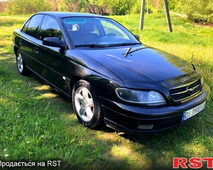 Черный Опель Омега, объемом двигателя 2.2 л и пробегом 350 тыс. км за 3000 $, фото 1 на Automoto.ua