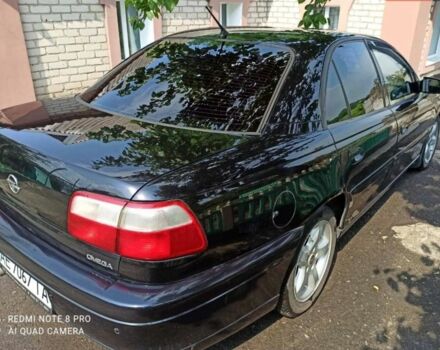 Черный Опель Омега, объемом двигателя 2.2 л и пробегом 304 тыс. км за 3200 $, фото 2 на Automoto.ua