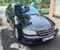 Черный Опель Омега, объемом двигателя 2.2 л и пробегом 304 тыс. км за 4000 $, фото 1 на Automoto.ua