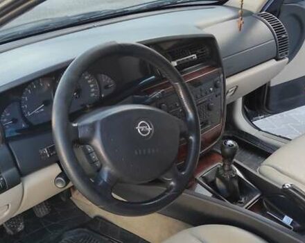 Черный Опель Омега, объемом двигателя 2.5 л и пробегом 288 тыс. км за 4800 $, фото 15 на Automoto.ua