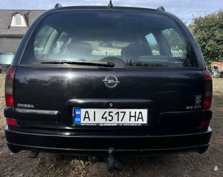 Черный Опель Омега, объемом двигателя 2.5 л и пробегом 300 тыс. км за 4000 $, фото 2 на Automoto.ua