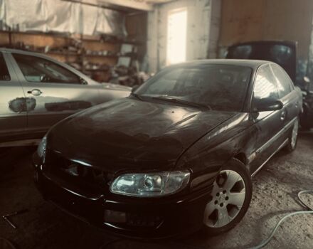 Черный Опель Омега, объемом двигателя 2.5 л и пробегом 47 тыс. км за 2000 $, фото 1 на Automoto.ua