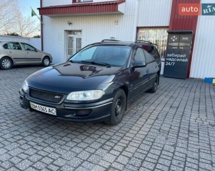 Черный Опель Омега, объемом двигателя 2 л и пробегом 250 тыс. км за 1999 $, фото 1 на Automoto.ua