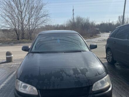 Черный Опель Омега, объемом двигателя 2.6 л и пробегом 270 тыс. км за 2000 $, фото 1 на Automoto.ua