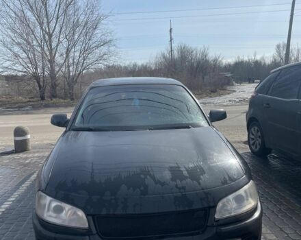 Черный Опель Омега, объемом двигателя 2.6 л и пробегом 270 тыс. км за 2000 $, фото 1 на Automoto.ua