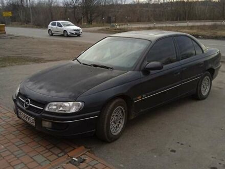 Черный Опель Омега, объемом двигателя 2.5 л и пробегом 328 тыс. км за 3000 $, фото 1 на Automoto.ua