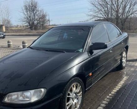 Черный Опель Омега, объемом двигателя 2.6 л и пробегом 270 тыс. км за 2000 $, фото 1 на Automoto.ua