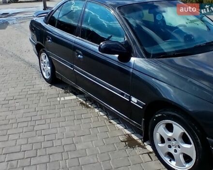 Черный Опель Омега, объемом двигателя 2.5 л и пробегом 350 тыс. км за 1300 $, фото 1 на Automoto.ua