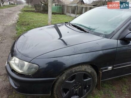 Черный Опель Омега, объемом двигателя 2.5 л и пробегом 340 тыс. км за 2596 $, фото 1 на Automoto.ua