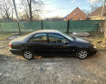 Черный Опель Омега, объемом двигателя 2.5 л и пробегом 242 тыс. км за 2650 $, фото 1 на Automoto.ua