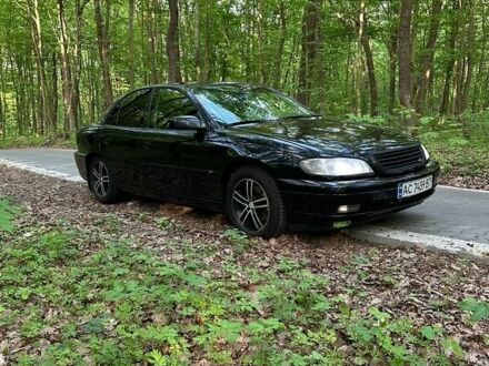 Черный Опель Омега, объемом двигателя 2.2 л и пробегом 461 тыс. км за 3300 $, фото 1 на Automoto.ua
