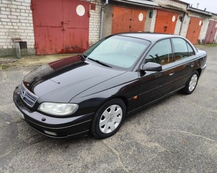 Черный Опель Омега, объемом двигателя 2.2 л и пробегом 249 тыс. км за 3350 $, фото 1 на Automoto.ua