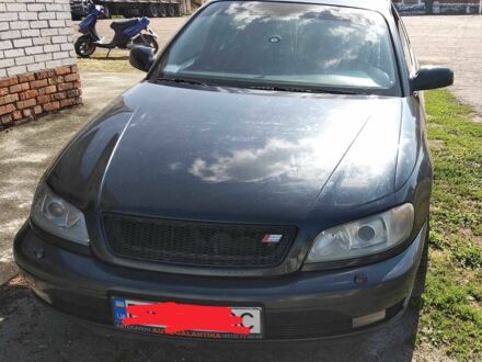 Черный Опель Омега, объемом двигателя 2.5 л и пробегом 300 тыс. км за 3500 $, фото 1 на Automoto.ua