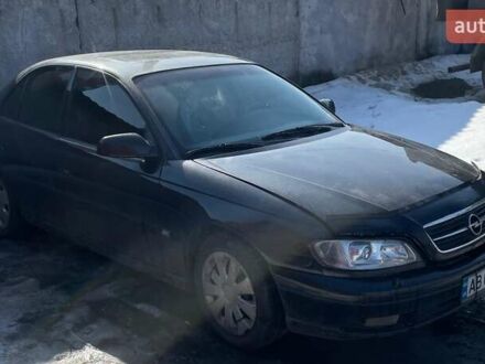 Черный Опель Омега, объемом двигателя 2.2 л и пробегом 263 тыс. км за 2000 $, фото 1 на Automoto.ua