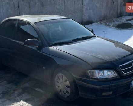 Черный Опель Омега, объемом двигателя 2.2 л и пробегом 263 тыс. км за 2000 $, фото 1 на Automoto.ua