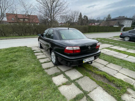 Черный Опель Омега, объемом двигателя 2.2 л и пробегом 250 тыс. км за 3900 $, фото 1 на Automoto.ua