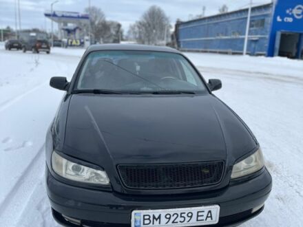 Черный Опель Омега, объемом двигателя 2.6 л и пробегом 250 тыс. км за 2200 $, фото 1 на Automoto.ua