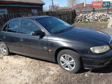 Черный Опель Омега, объемом двигателя 2.2 л и пробегом 330 тыс. км за 2500 $, фото 1 на Automoto.ua
