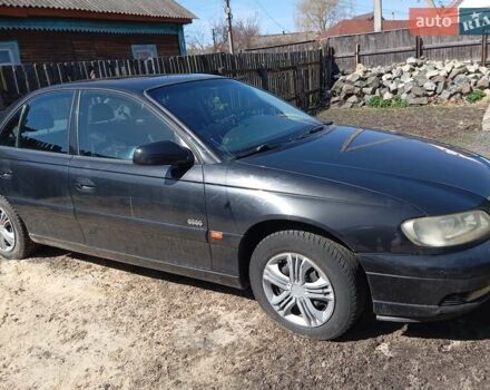Черный Опель Омега, объемом двигателя 2.2 л и пробегом 330 тыс. км за 2500 $, фото 1 на Automoto.ua