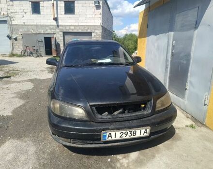 Черный Опель Омега, объемом двигателя 2.2 л и пробегом 300 тыс. км за 1500 $, фото 1 на Automoto.ua