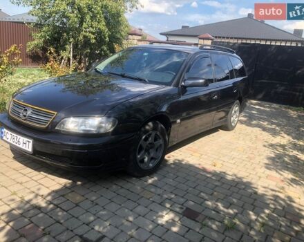 Черный Опель Омега, объемом двигателя 2.2 л и пробегом 395 тыс. км за 3400 $, фото 1 на Automoto.ua