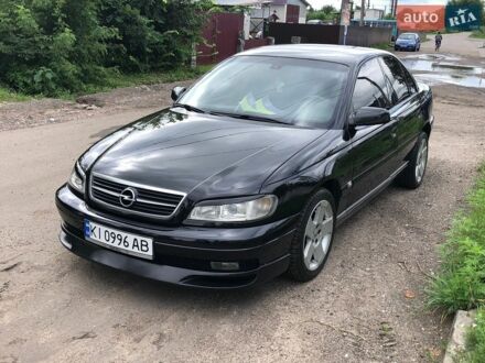 Черный Опель Омега, объемом двигателя 2.2 л и пробегом 345 тыс. км за 3800 $, фото 1 на Automoto.ua