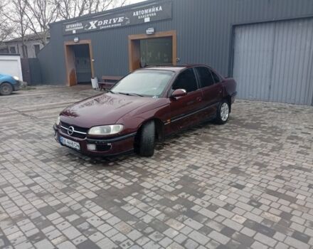 Червоний Опель Омега, об'ємом двигуна 2 л та пробігом 65 тис. км за 1550 $, фото 12 на Automoto.ua