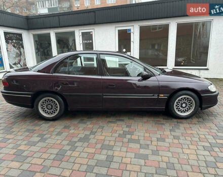 Красный Опель Омега, объемом двигателя 2 л и пробегом 301 тыс. км за 2200 $, фото 2 на Automoto.ua