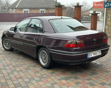 Красный Опель Омега, объемом двигателя 2 л и пробегом 301 тыс. км за 2250 $, фото 1 на Automoto.ua