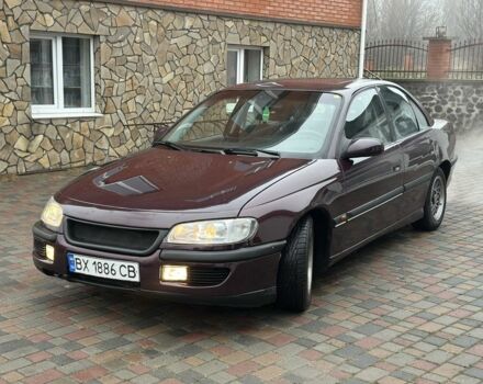 Червоний Опель Омега, об'ємом двигуна 2 л та пробігом 301 тис. км за 2200 $, фото 5 на Automoto.ua